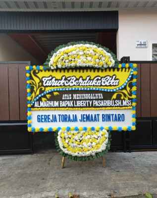 Papan Bunga Duka di Mokoni